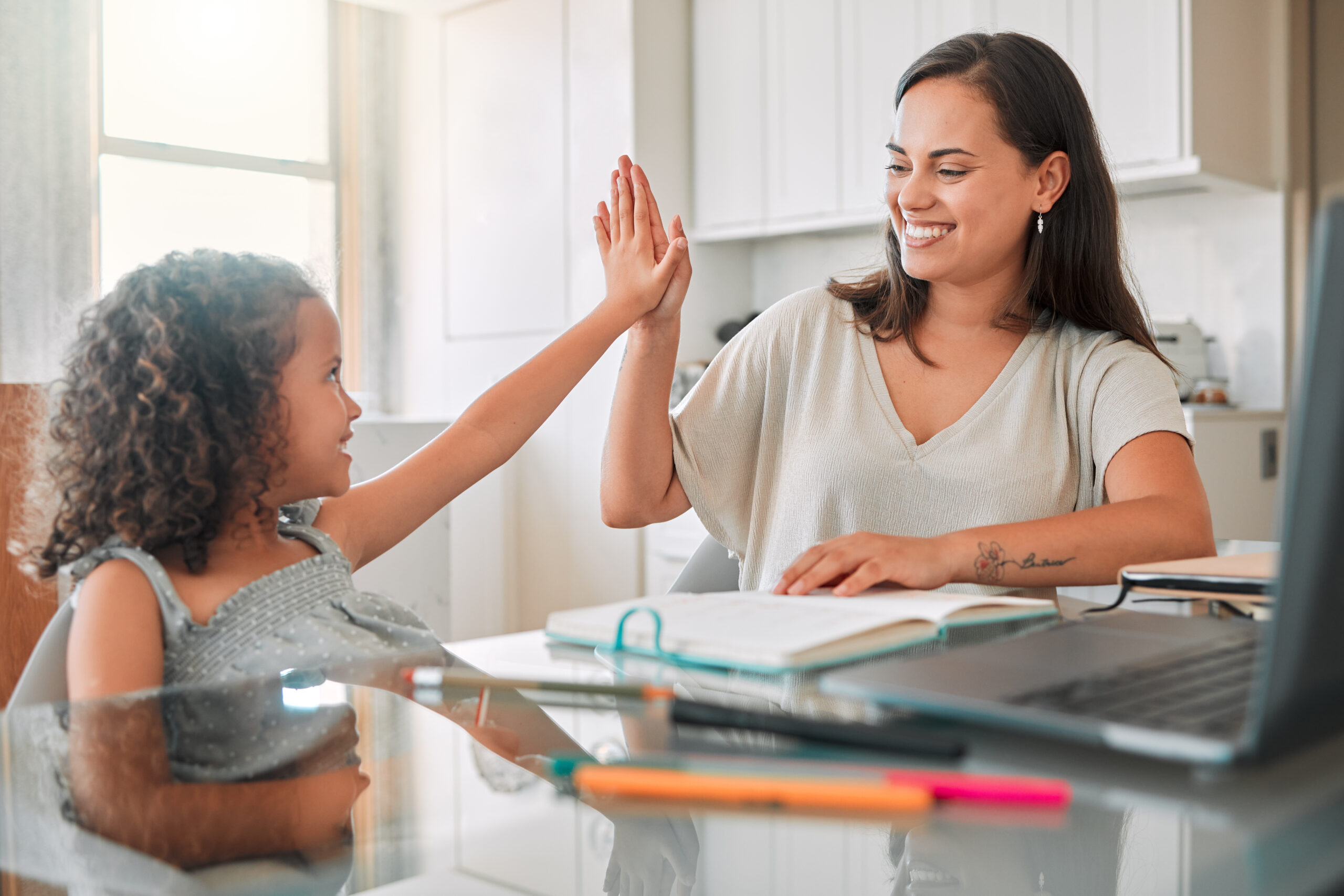 cheerful-girl-high-fiving-woman-in-a-bright-kitche-2026-03-25-02-18-06-utc Cheerful girl high fiving woman in a bright kitche 03 25 02 18 06 utc
