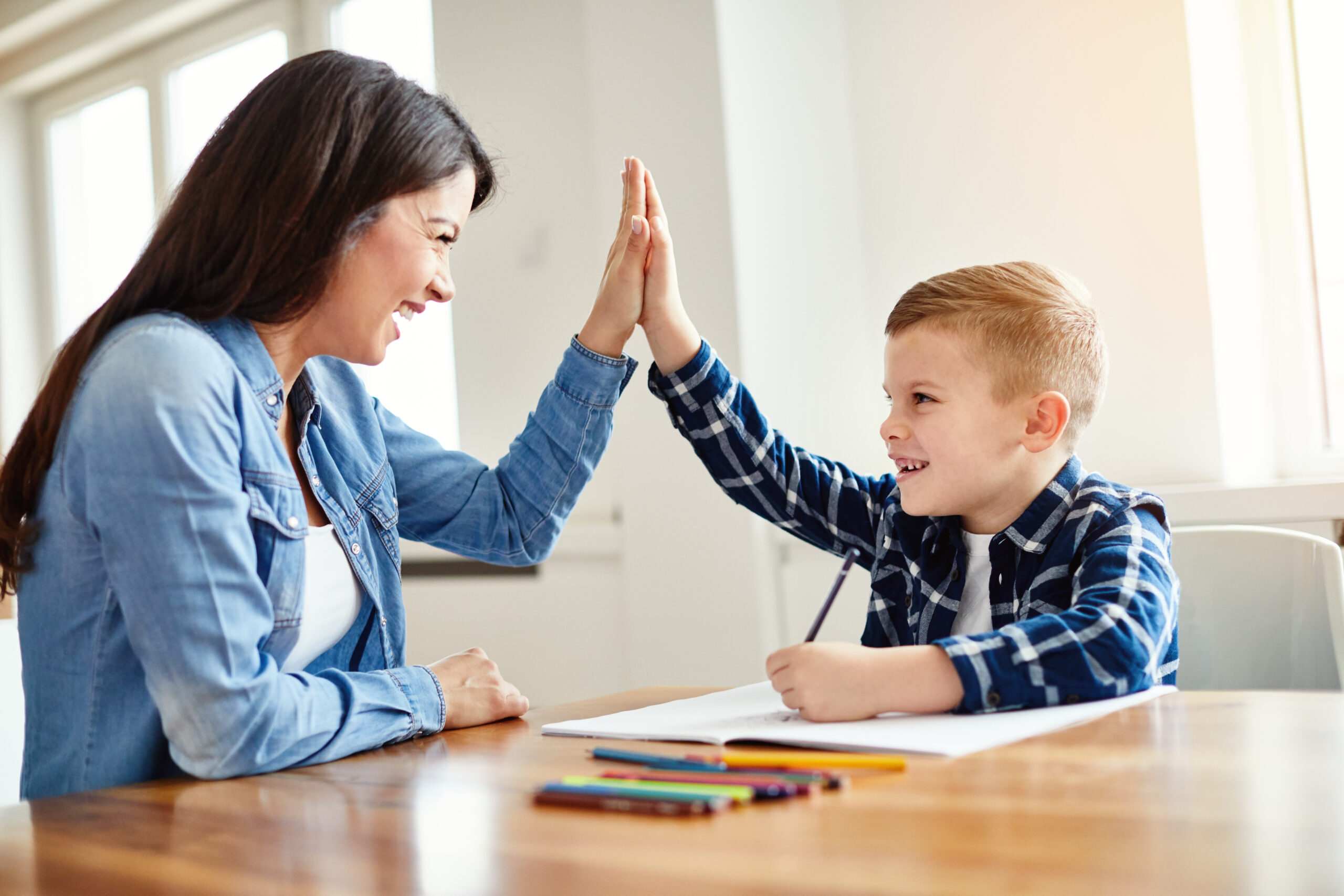homework teaching boy high five education mother children son familiy childhood Homework teaching boy high five education mother children son familiy childhood